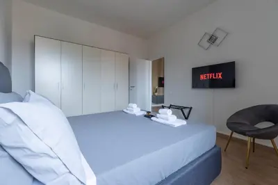 Letto o letti in una camera di Amazing Apt Free Private Parking 18 min by train to Florence