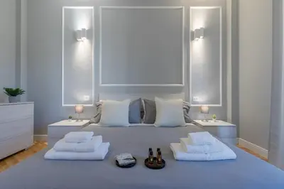 Letto o letti in una camera di Careggi-Rifredi CHIC Apartment Tramvia-Parking
