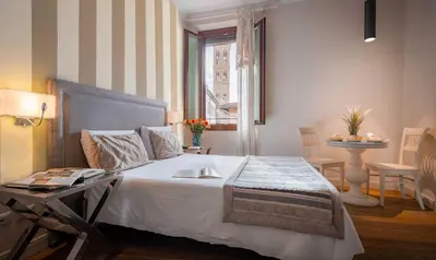 Letto o letti in una camera di Boutique Hotel del Corso