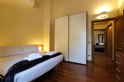 Letto o letti in una camera di Wine Apartments Florence Barbaresco