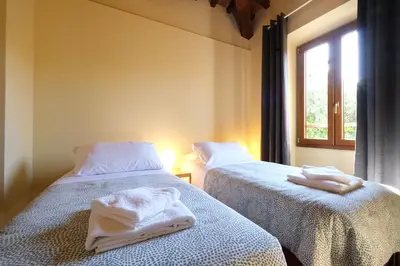 Letto o letti in una camera di Wine Apartments Florence Barbaresco