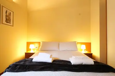Letto o letti in una camera di Wine Apartments Florence Barbaresco