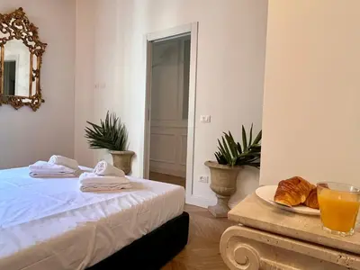 Letto o letti in una camera di Petit Paris Fiorentina