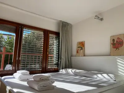 Letto o letti in una camera di Relaxing Garden Apt Near Historic Florence