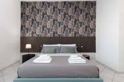 Letto o letti in una camera di Manifattura Tabacchi Holiday Home