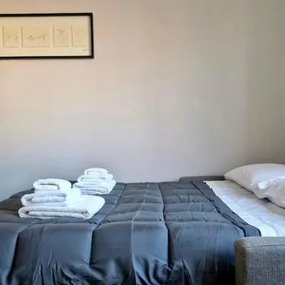 Letto o letti in una camera di Manifattura Tabacchi Holiday Home