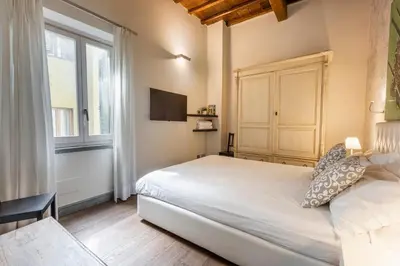 Letto o letti in una camera di Cosy Suites in Glamorous Santo Spirito PLUS