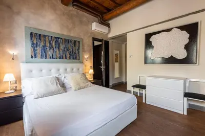 Letto o letti in una camera di Cosy Suites in Glamorous Santo Spirito PLUS