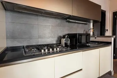 Cucina o angolo cottura di Cosy Suites in Glamorous Santo Spirito PLUS