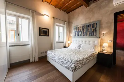 Letto o letti in una camera di Cosy Suites in Glamorous Santo Spirito PLUS
