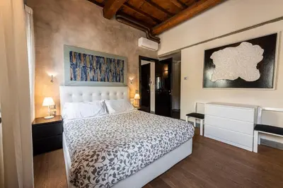 Letto o letti in una camera di Cosy Suites in Glamorous Santo Spirito PLUS