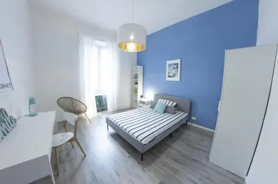 Letto o letti in una camera di UNYCA - Florence Modern 3-bedroom Apartment
