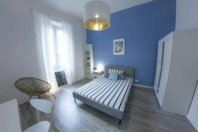 Letto o letti in una camera di UNYCA - Florence Modern 3-bedroom Apartment