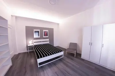 Letto o letti in una camera di UNYCA - 4 bedroom Apartment in Florence
