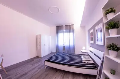 Letto o letti in una camera di UNYCA - 4 bedroom Apartment in Florence
