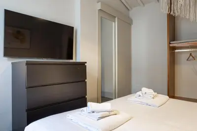Letto o letti in una camera di Santo Spirito Rooftop Retreat