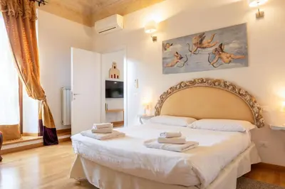 Letto o letti in una camera di Sant'Ambrogio Apartments - Donatello