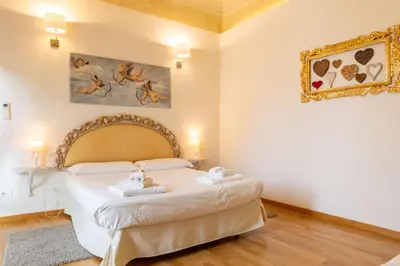 Letto o letti in una camera di Sant'Ambrogio Apartments - Donatello
