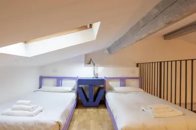 Letto o letti in una camera di Sant'Ambrogio Apartments - Leonardo