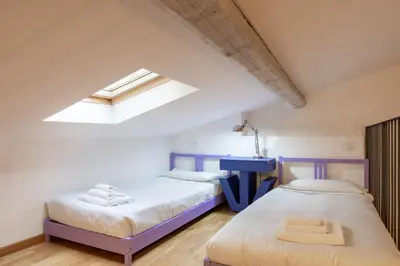 Letto o letti in una camera di Sant'Ambrogio Apartments - Leonardo