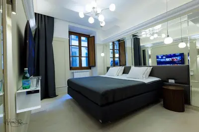 Letto o letti in una camera di Adam And Eve Florence