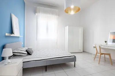 Letto o letti in una camera di UNYCA - Florence Modern 4-bedroom Apartment