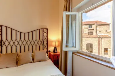 Letto o letti in una camera di A green flat in Via della Vigna Nuova