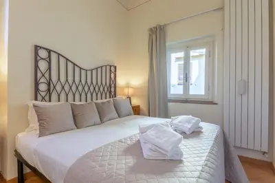 Letto o letti in una camera di A green flat in Via della Vigna Nuova