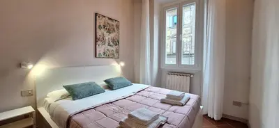 Letto o letti in una camera di Casa Mimosa