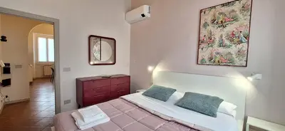 Letto o letti in una camera di Casa Mimosa