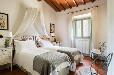 Letto o letti in una camera di Casavilla Rentals by Torre a Cona