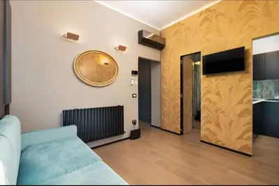TV o dispositivi per l'intrattenimento presso Florence Holiday Apartment Ponte Vecchio Glow Suite Jacuzzi
