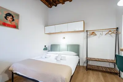 Letto o letti in una camera di GuestHost - Sweet Faenza - San Lorenzo Lovely Nest