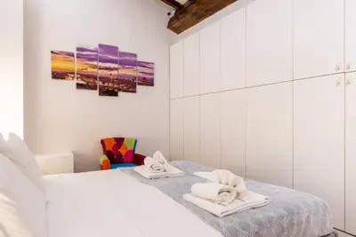 Letto o letti in una camera di Duomo Sky Terrace