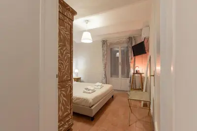 Letto o letti in una camera di San Ambrogio Courtyard in Florence