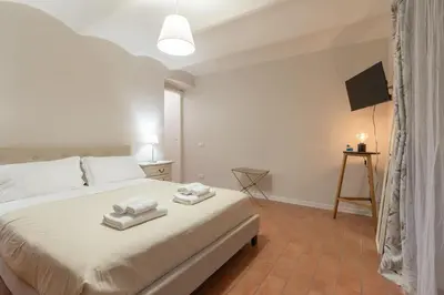 Letto o letti in una camera di San Ambrogio Courtyard in Florence