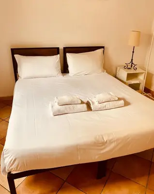 Letto o letti in una camera di Casa Luna