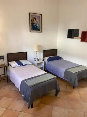 Letto o letti in una camera di Casa Luna