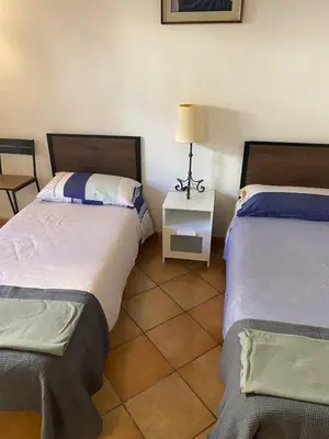 Letto o letti in una camera di Casa Luna