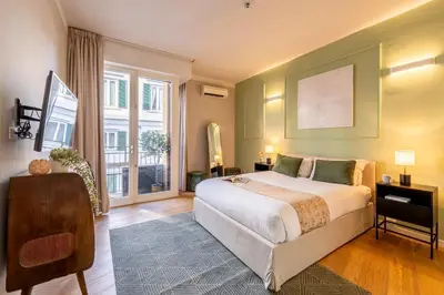 Letto o letti in una camera di Genteel Home Teatro Verdi Firenze