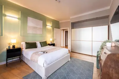 Letto o letti in una camera di Genteel Home Teatro Verdi Firenze