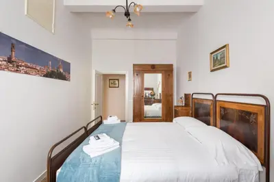 Letto o letti in una camera di Le Grazie Suite 1 in Florence