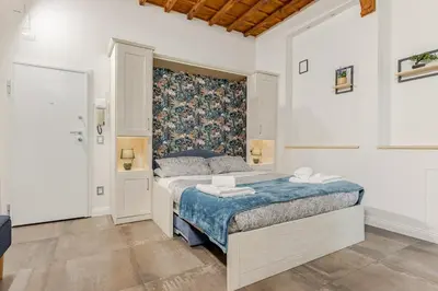 Letto o letti in una camera di Santa Croce Suite Centro di Firenze, 9 min Duomo