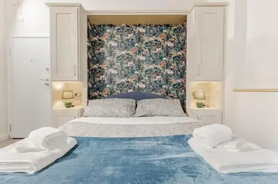 Letto o letti in una camera di Santa Croce Suite Centro di Firenze, 9 min Duomo