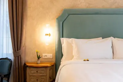 Letto o letti in una camera di Palazzo Doni by Florence Art Apartments