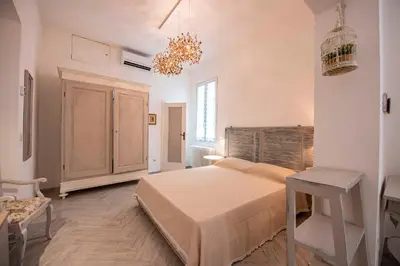 Letto o letti in una camera di Lanza Apartment by Mamo Florence