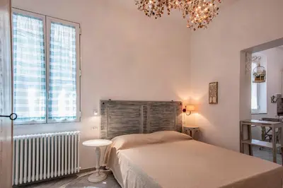 Letto o letti in una camera di Lanza Apartment by Mamo Florence