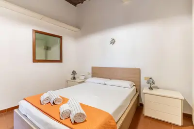 Letto o letti in una camera di GuestHost - Porta Romana Apartment