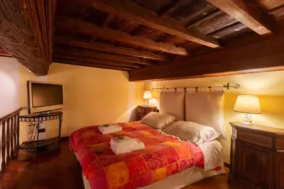 Letto o letti in una camera di Speziali Loft Firenze