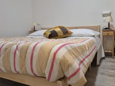 Letto o letti in una camera di VerdeLuna Home